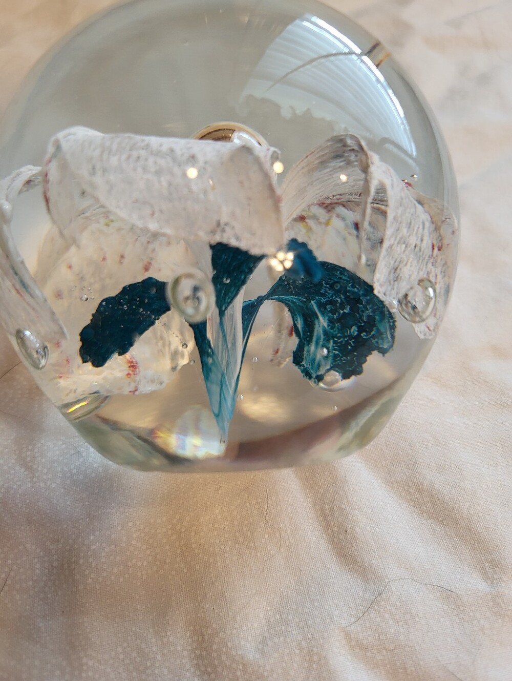 Handblown Glass Art 3 x 3 In. Sphere with White and Teal Floral Core Paperweight - Picture 5 of 10